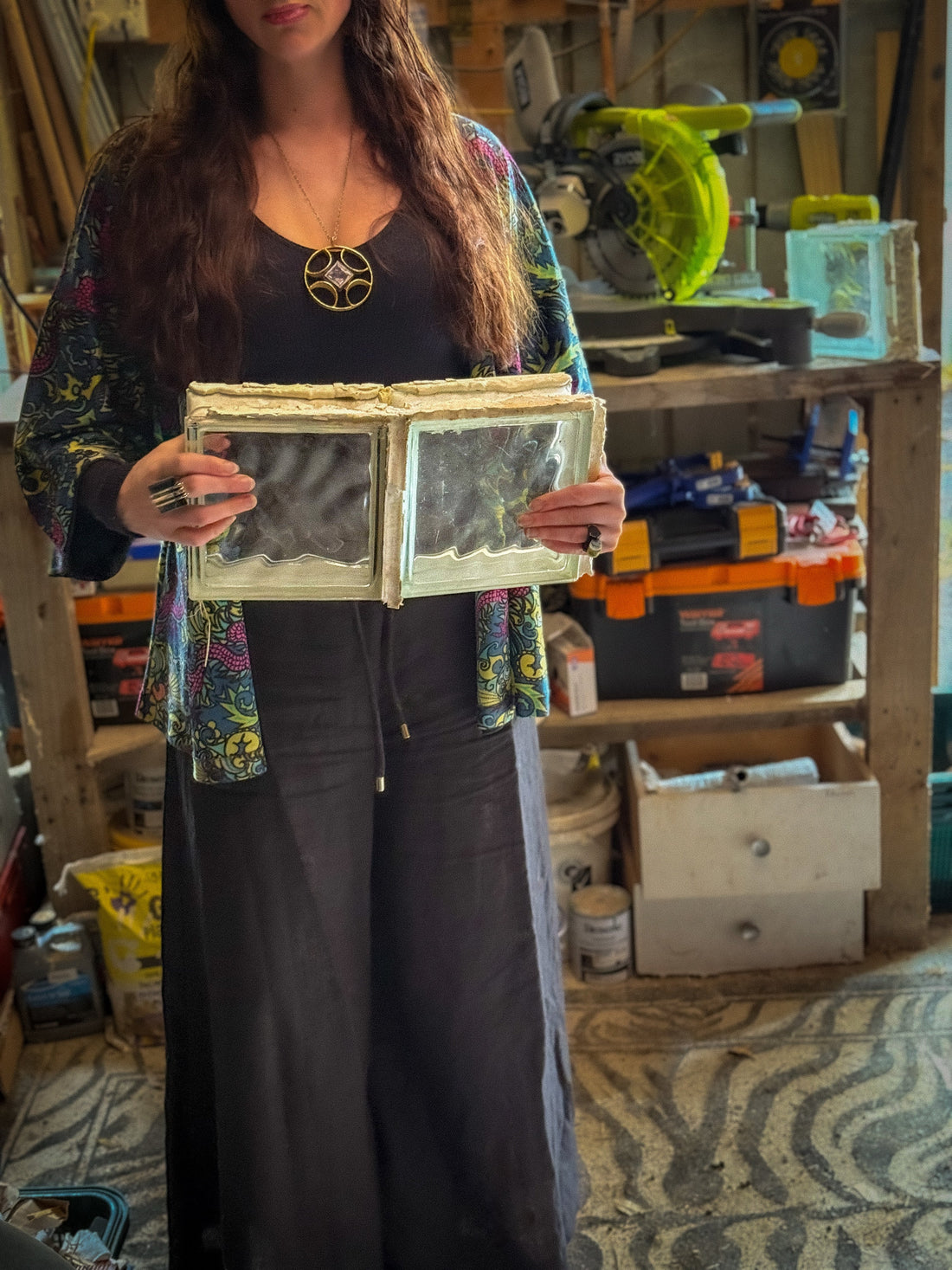 Person holding reclaimed materials ready to recycle them into a lamp
