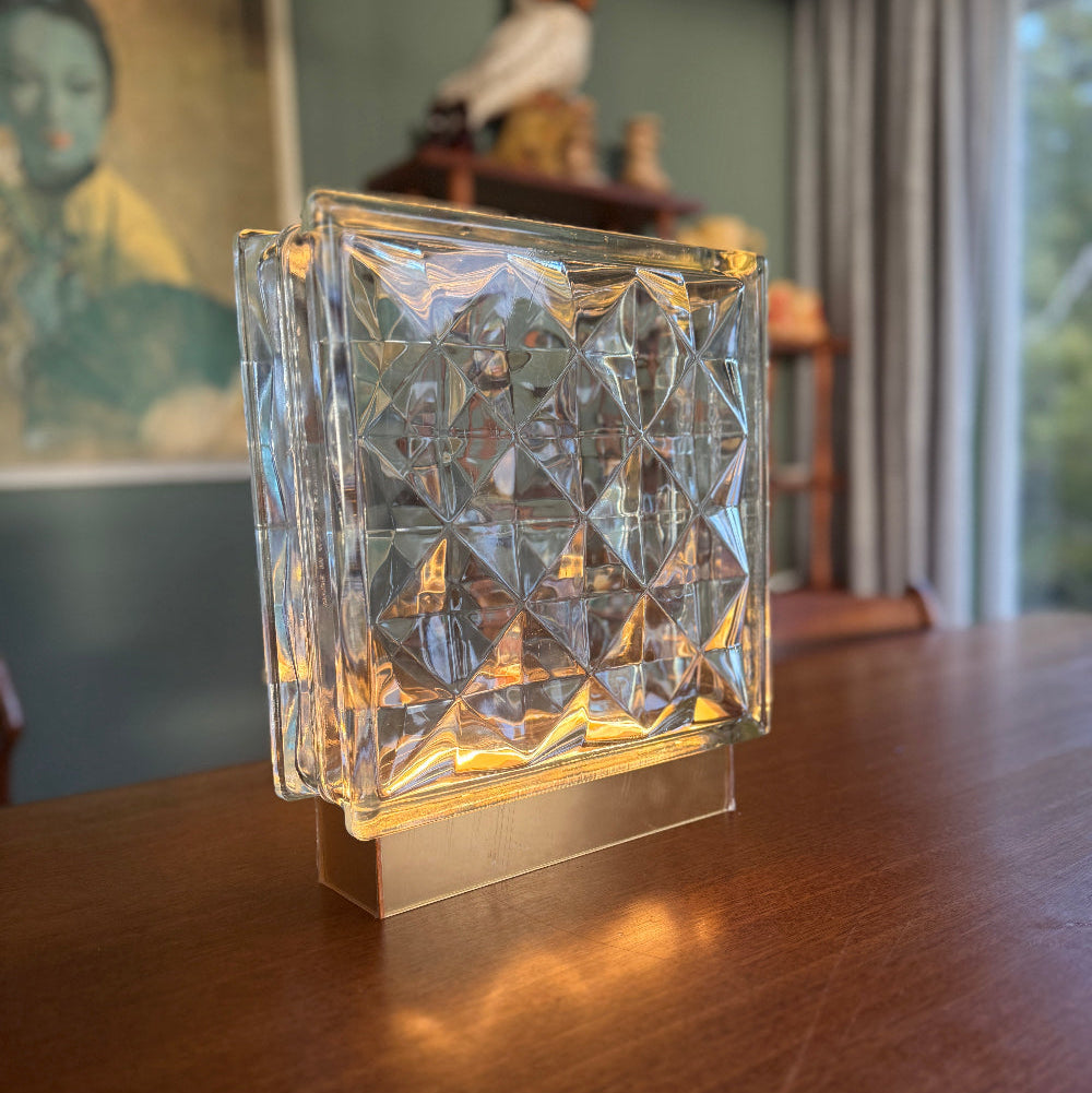 King Diamond Bloc Lamp with faceted glass block on its base in a room setting