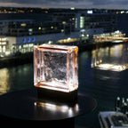Blush glass block lamp detail highlighting premium upcycled materials and LED warm glow