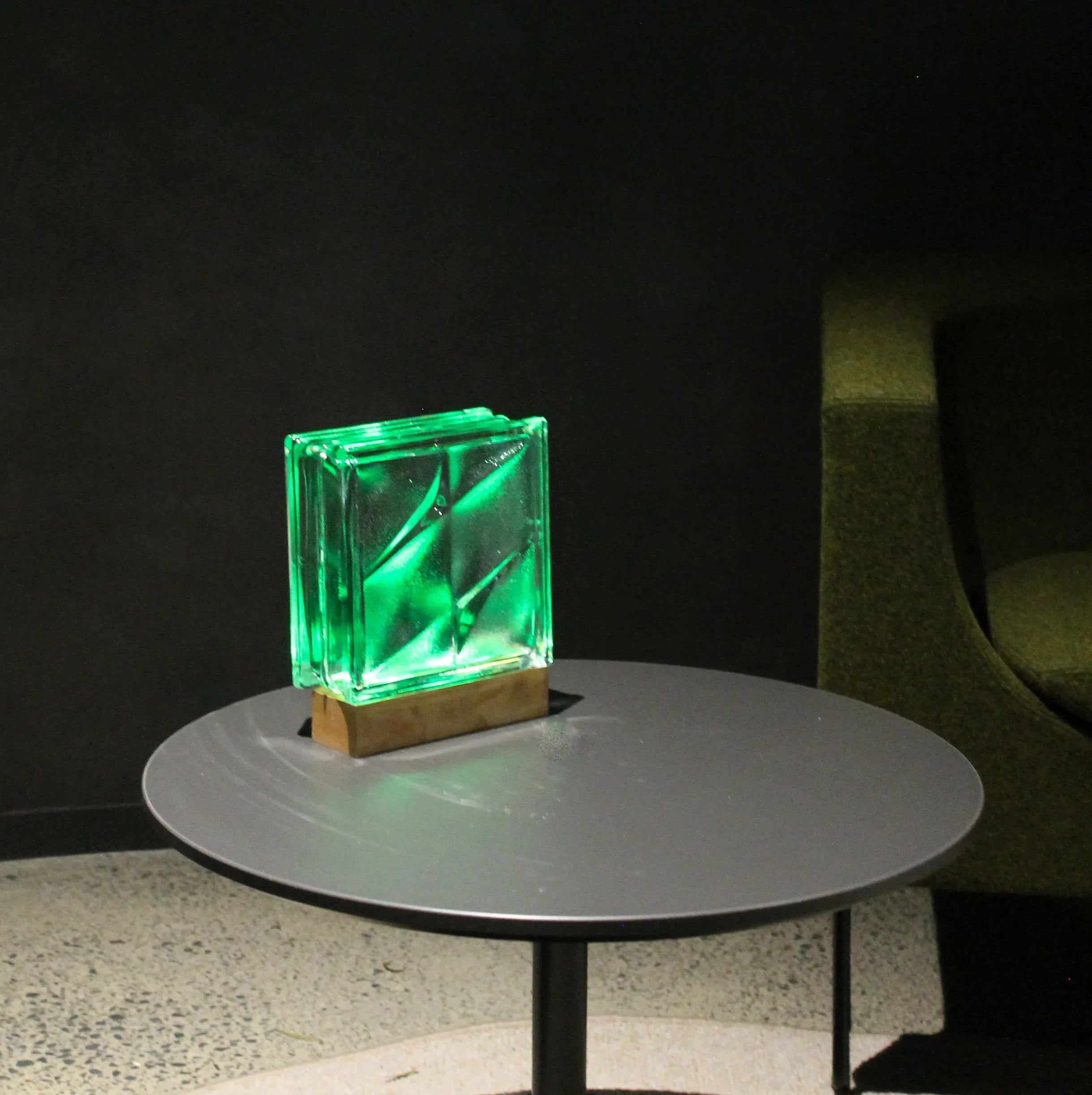 Bolt glass block lamp in home setting with warm atmospheric glow and cordless design